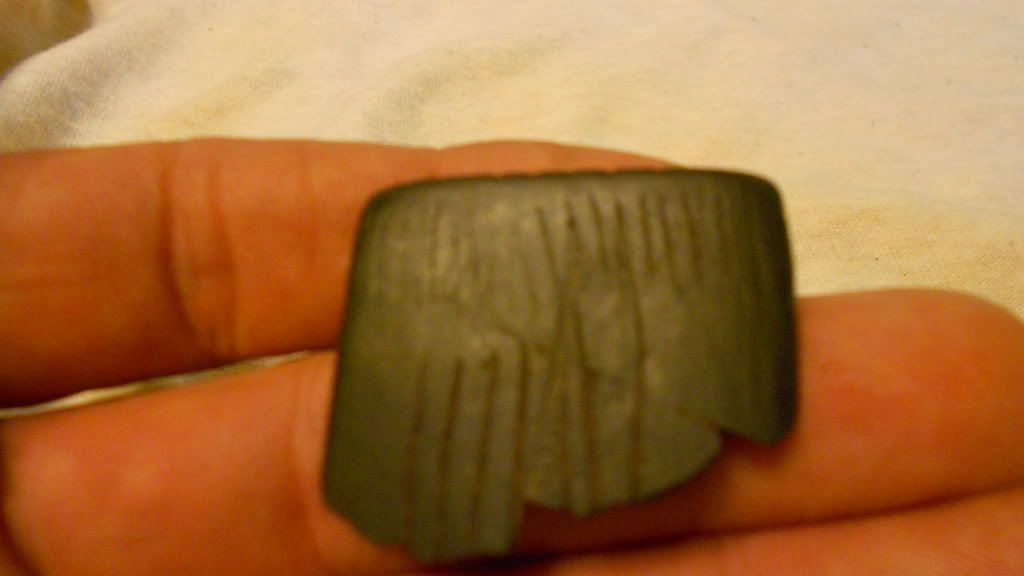 Bannerstone with tally marks.