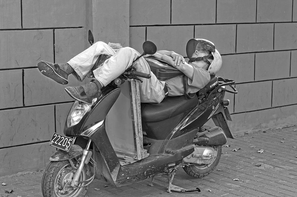 A_Man_is_sleeping_on_his_motobike_zps881ec7fa.jpg